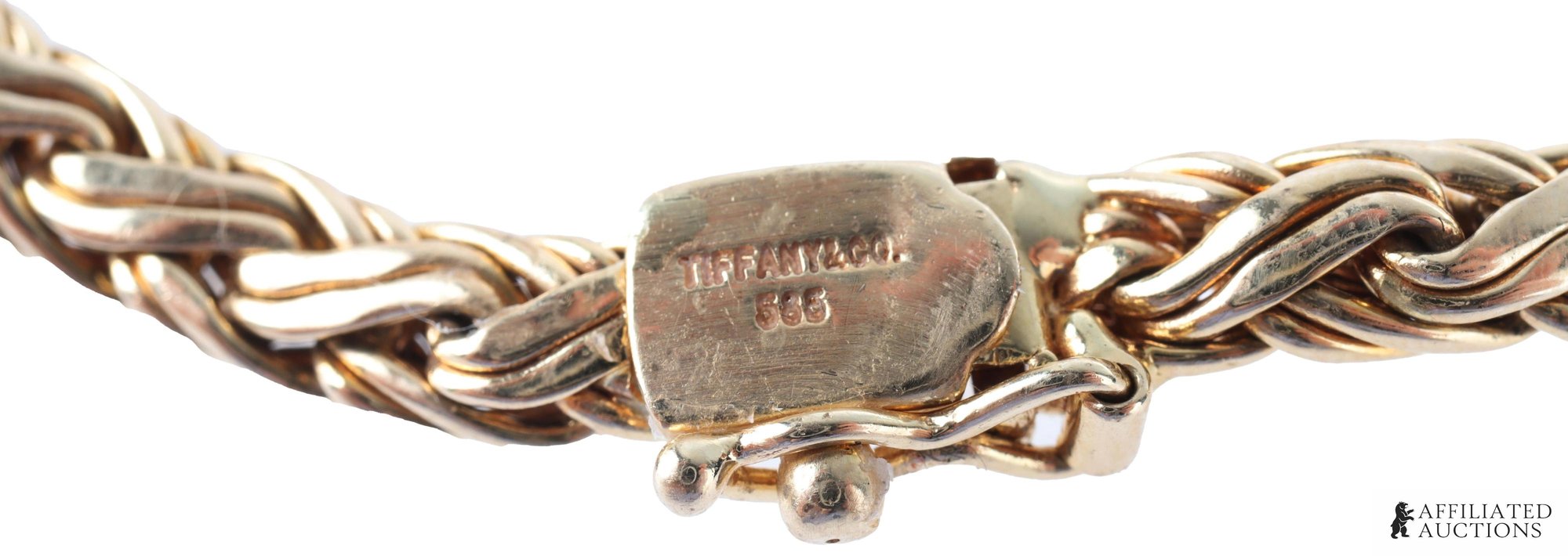 Close-up of the Tiffany & Co. 14K marks on the necklace clasp