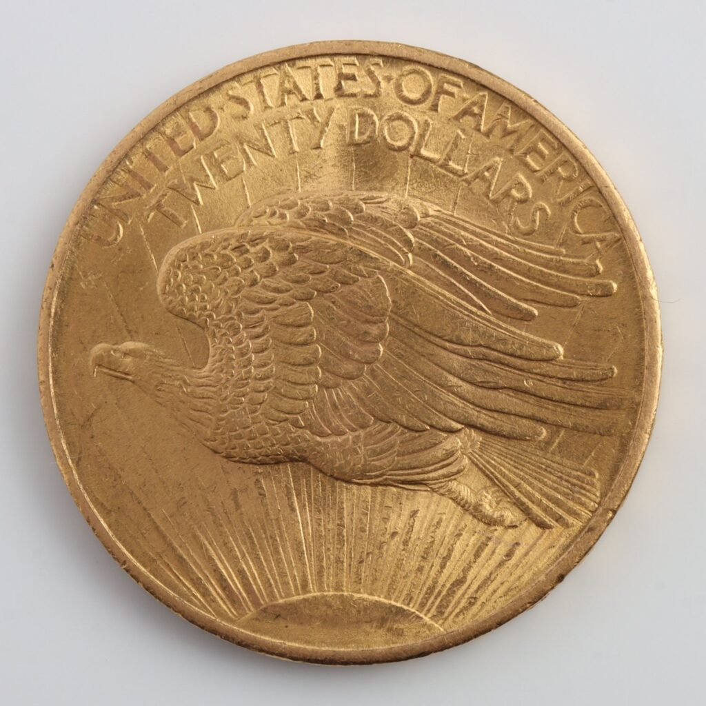 Obverse side of a United States twenty dollar gold coin featuring an eagle in flight.