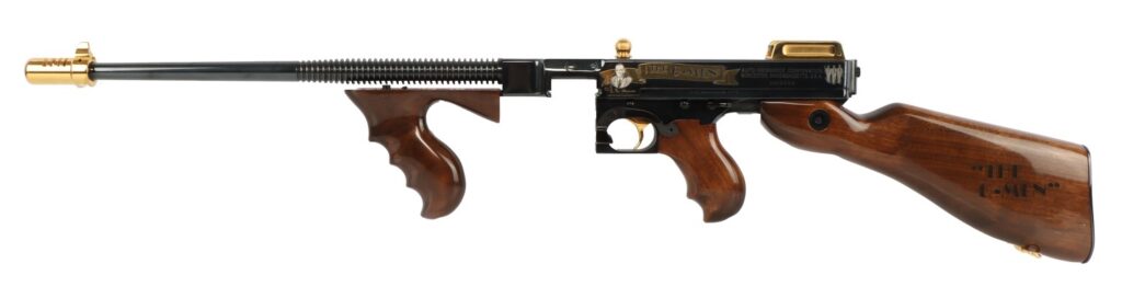 Side view of a vintage air pistol with a black barrel, wooden grips, and a gold muzzle accessory.