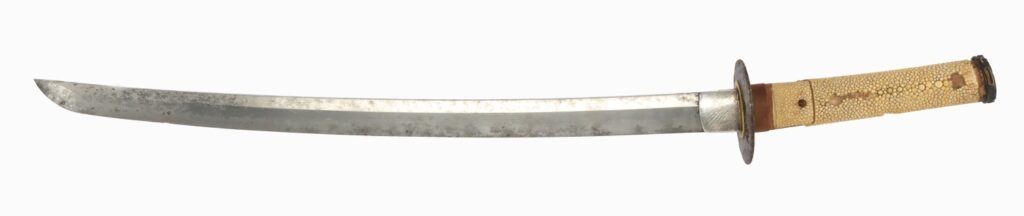A traditional curved sword with a long blade and a textured handle, featuring a metal guard.